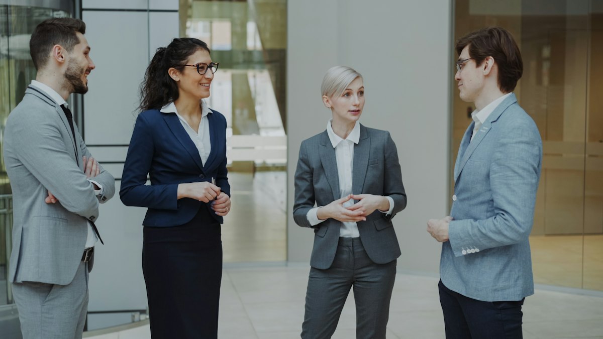 The Koralink Solutions team talking in the office